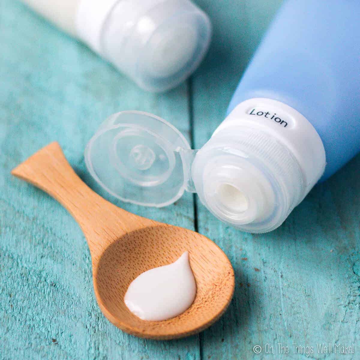 a homemade lotion being squirted onto a wooden spoon