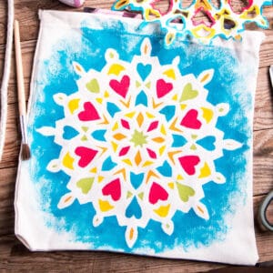 A bag with a hand-painted mandala design on it