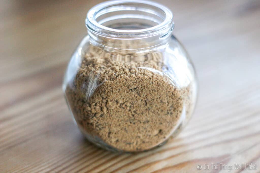 A glass container filled with brown sugar