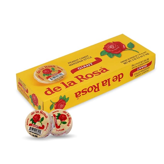 A yellow box of De La Rosa peanut candy marzipan style is shown with two individually wrapped round candies in front, reminiscent of classic marzipan figures.
