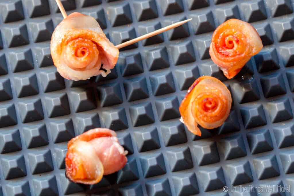 baking bacon roses on a textured silicone baking sheet