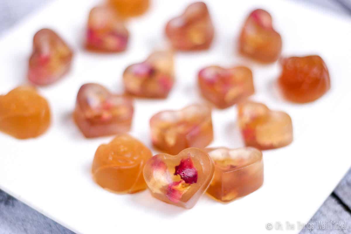 Close up of rose petal gummies on a plate.