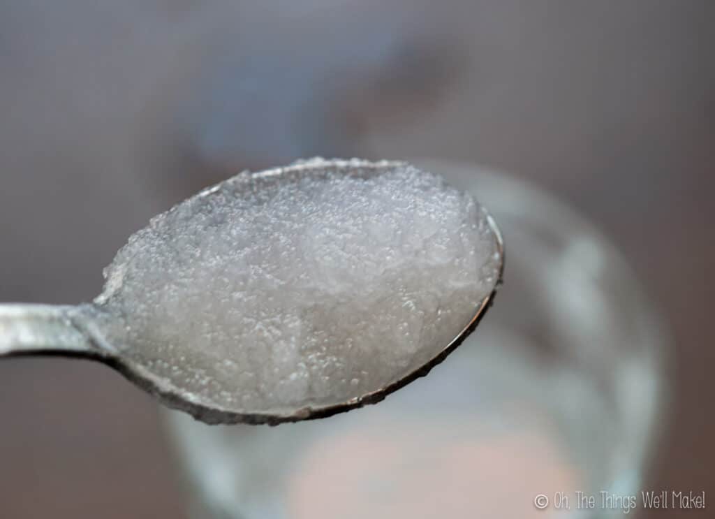 closeup of calcium acetate, vinegar, and alcohol mixture on a spoon