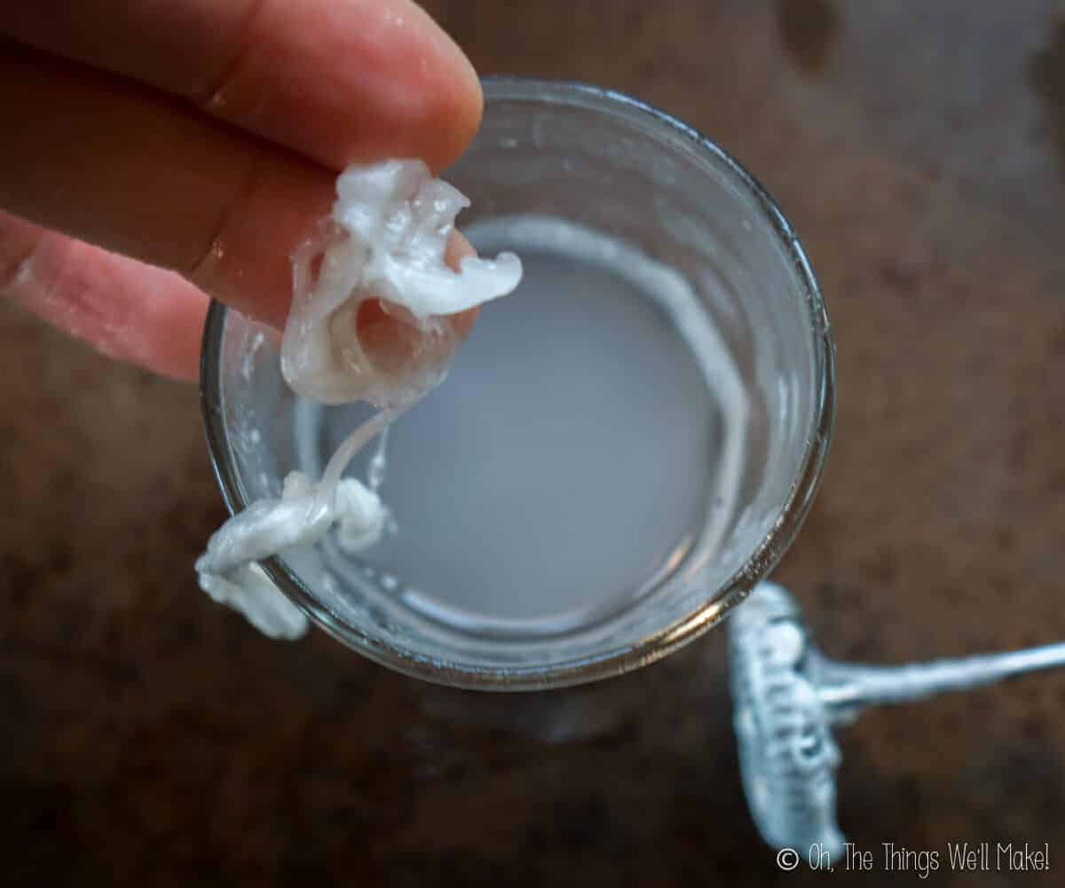 Overhead view of gummy mixture forming in a liquid