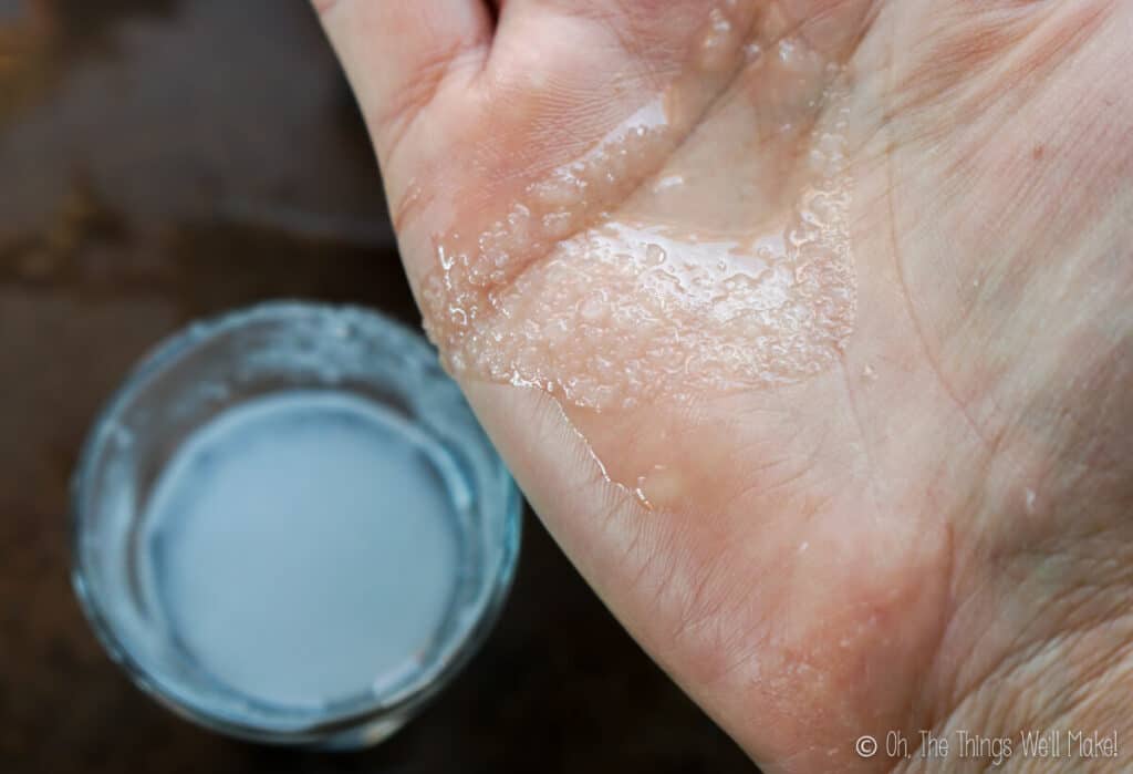 A closeup of the agar agar alcohol mixture rubbed over a hand, to show the grainy texture