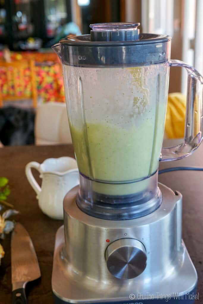 mixing up a green smoothie in a blender