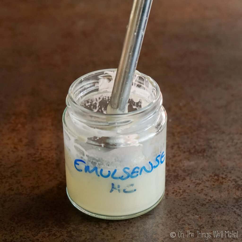 Blending the layers of the lotion together with an immersion blender