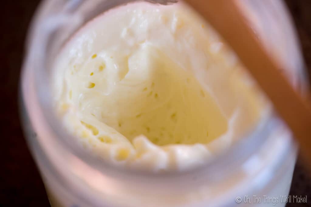 A closeup of a lotion made with Polawax, showing its mousse-like texture.