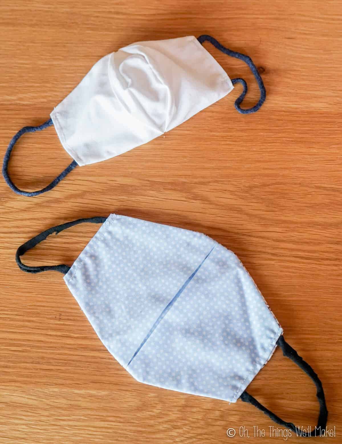 Overhead view of 2 face masks, one closed and one open.