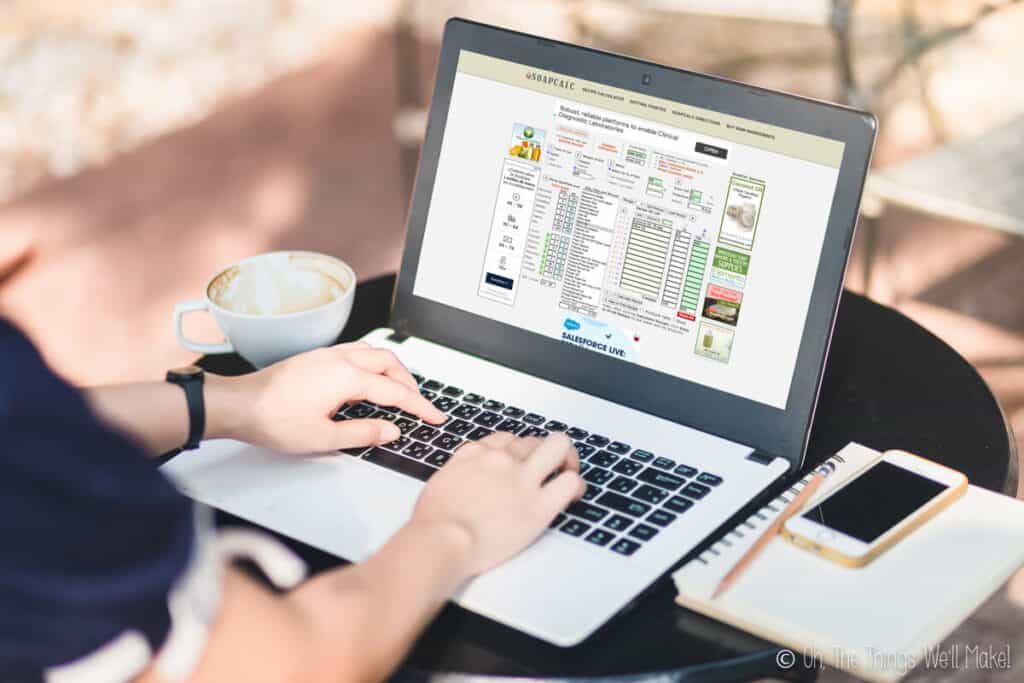 View of hands on a laptop computer. The computer shows the soapcalc lye calculator on the screen.