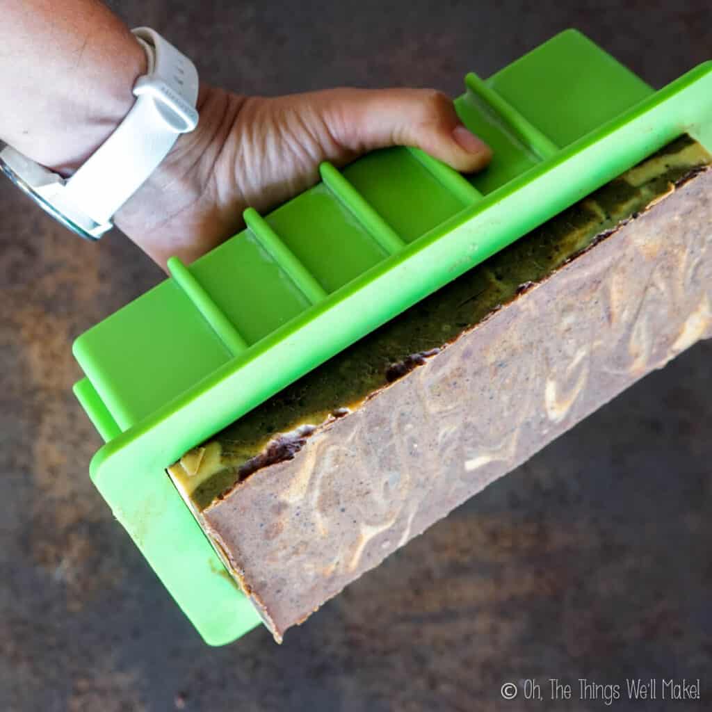 Unmolding a block of pumpkin spice soap