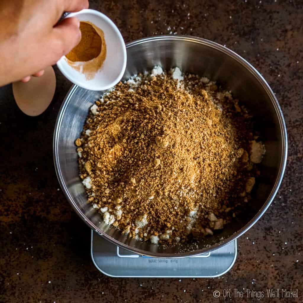 Adding cinnamon to the bowl
