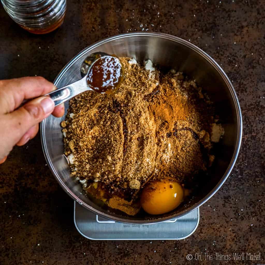 Adding honey to the bowl.