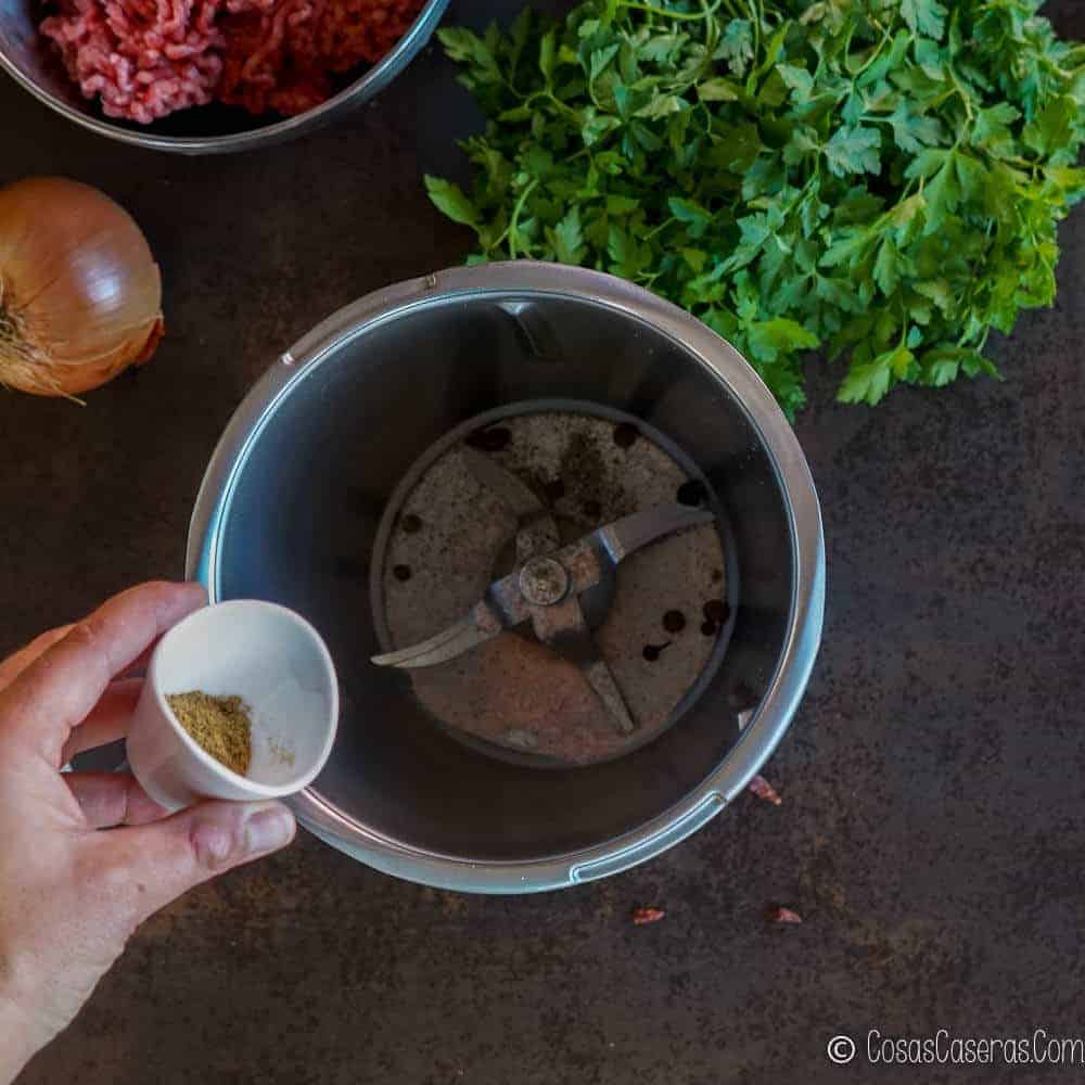 Adding spices to a food processor
