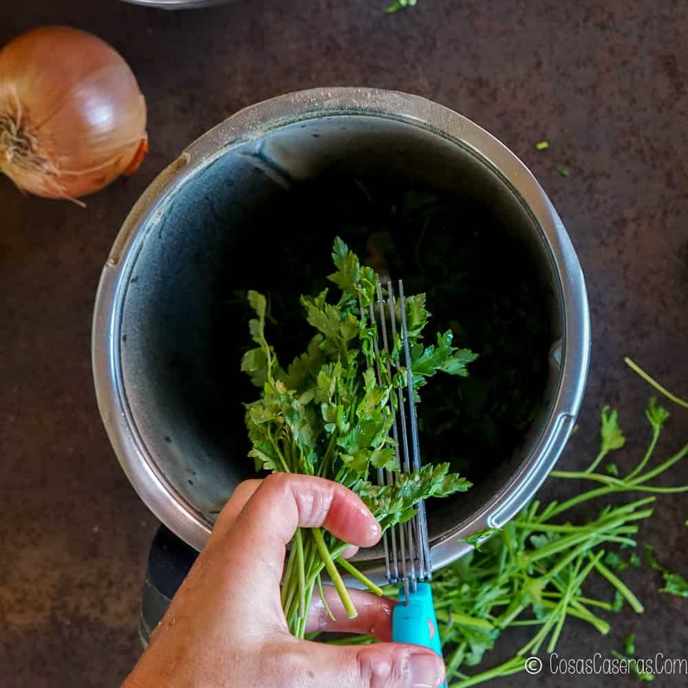 Adding parsley to a food processor