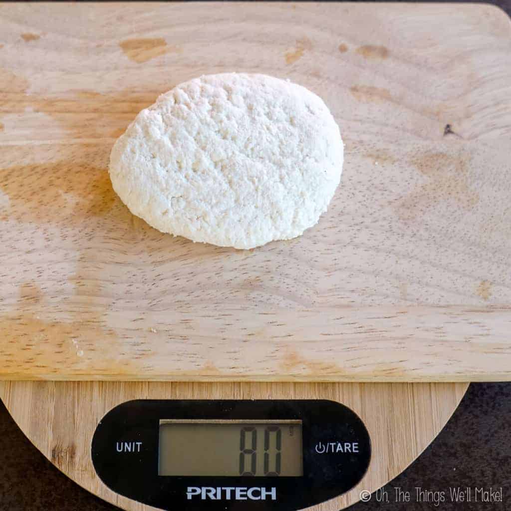 80g of skim milk paneer on a scale