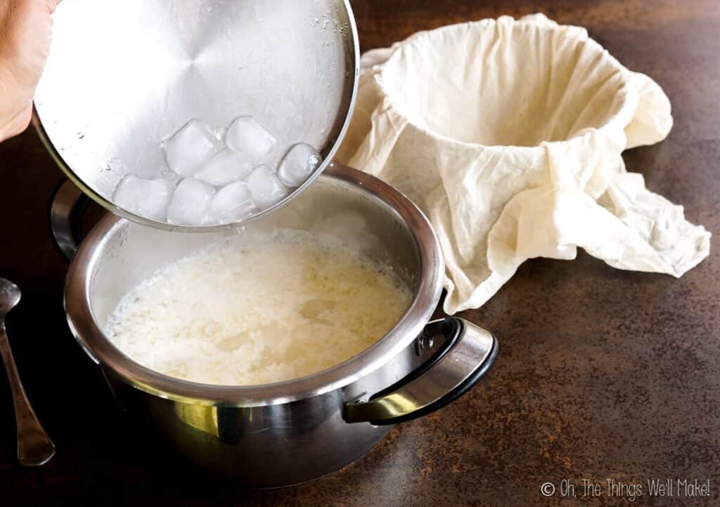 Adding ice cubes to a pan of curdled milk