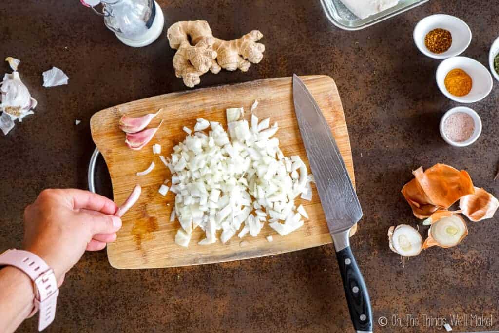 peeling a clove of garlic