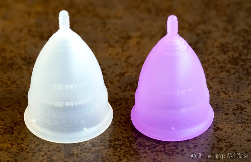 A large menstrual cup next to a small menstrual cup