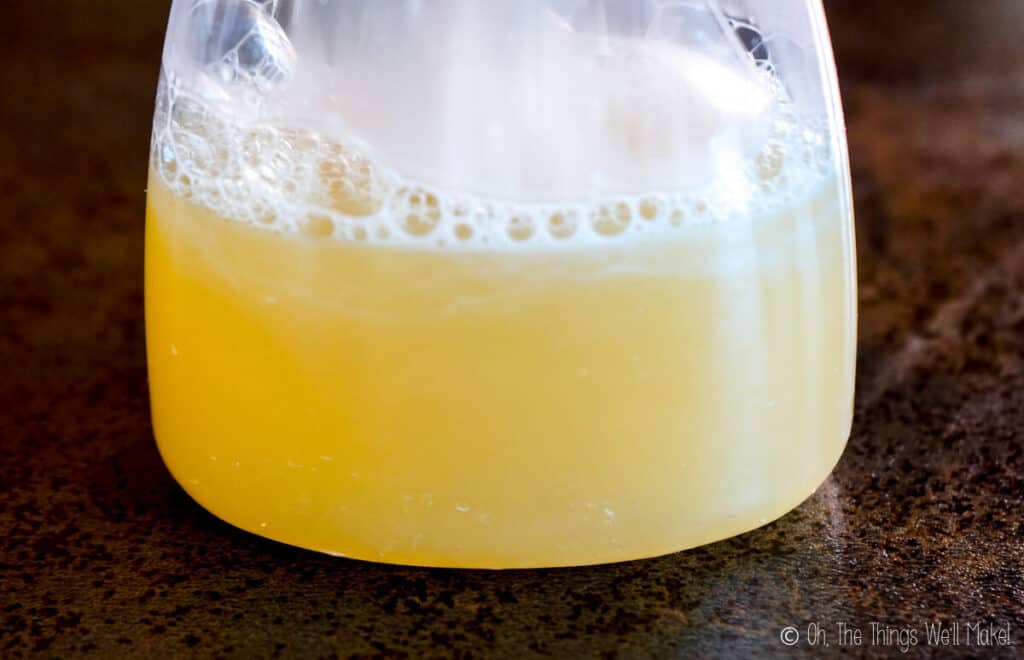 Closeup of a cloudy liquid soap in a transparent dispenser