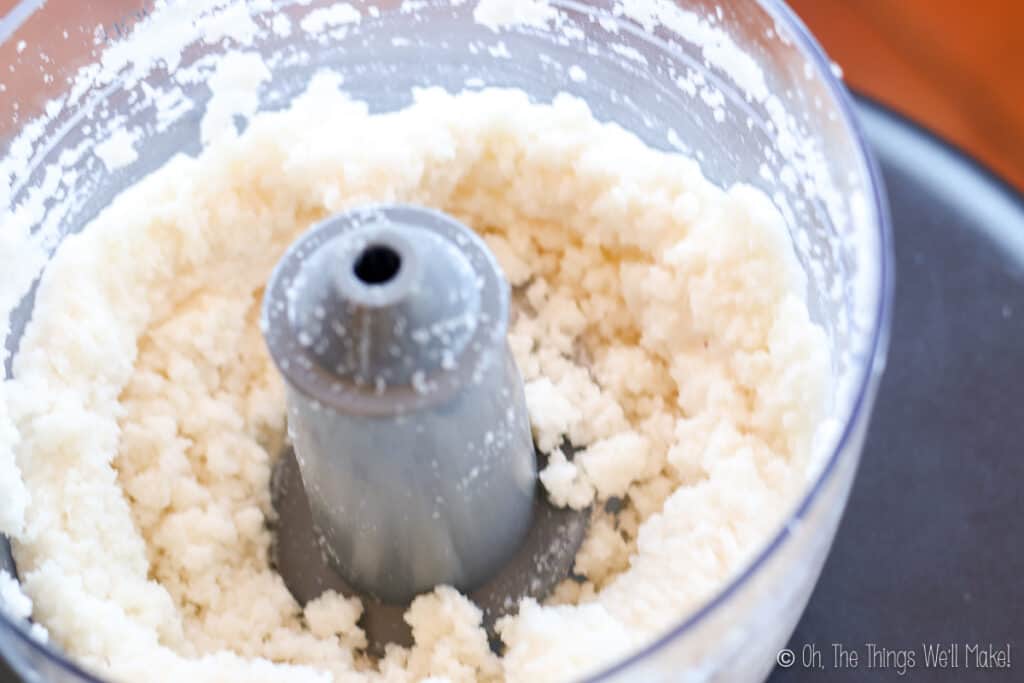 shredded dried coconut in a food processor after processing a short while, it begins to clump