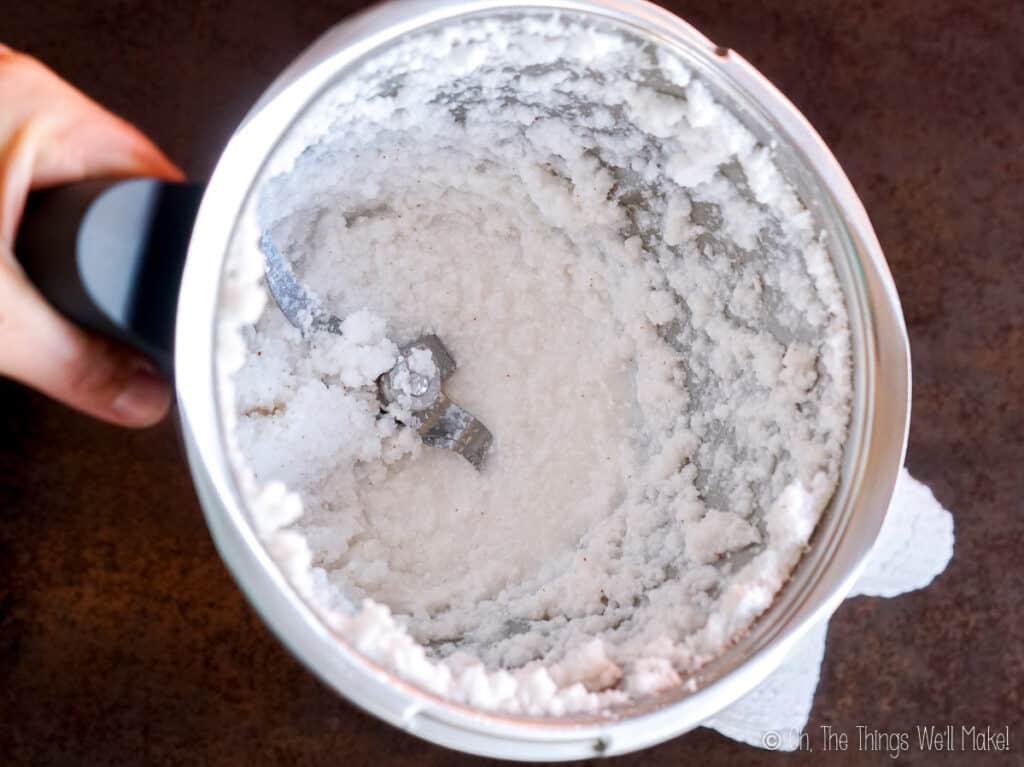 Overhead view of the coconut pulp blended with water in a food processor