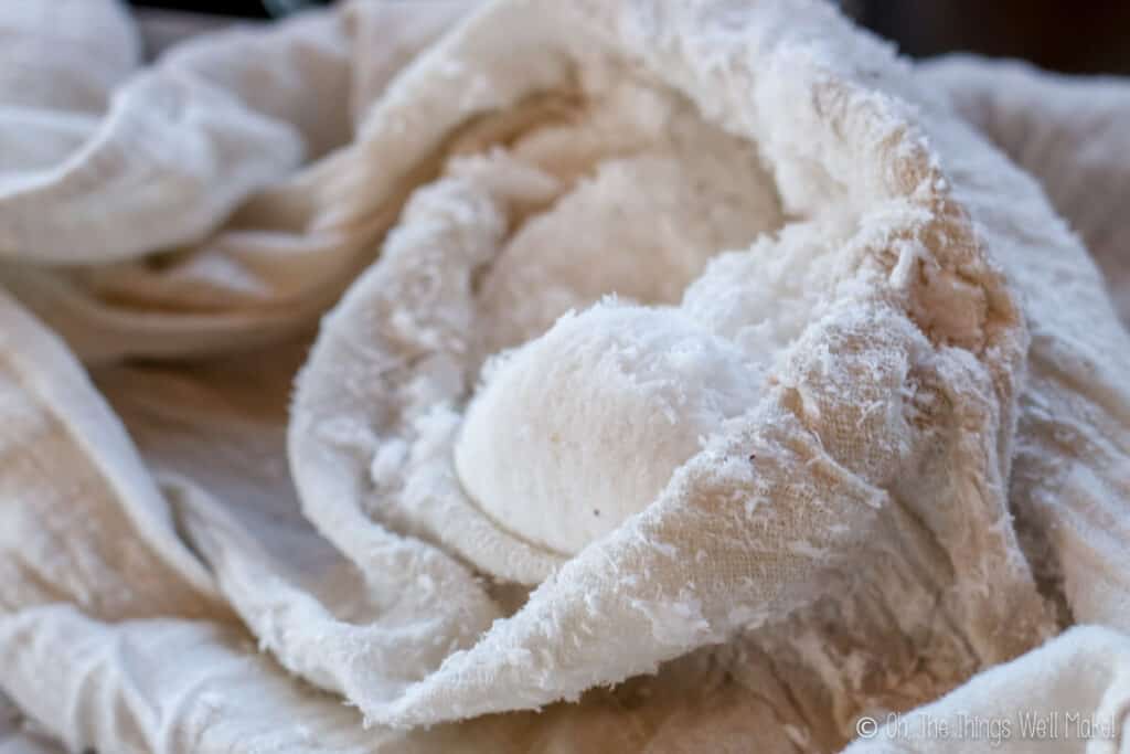 coconut pulp in a cloth after straining out coconut milk