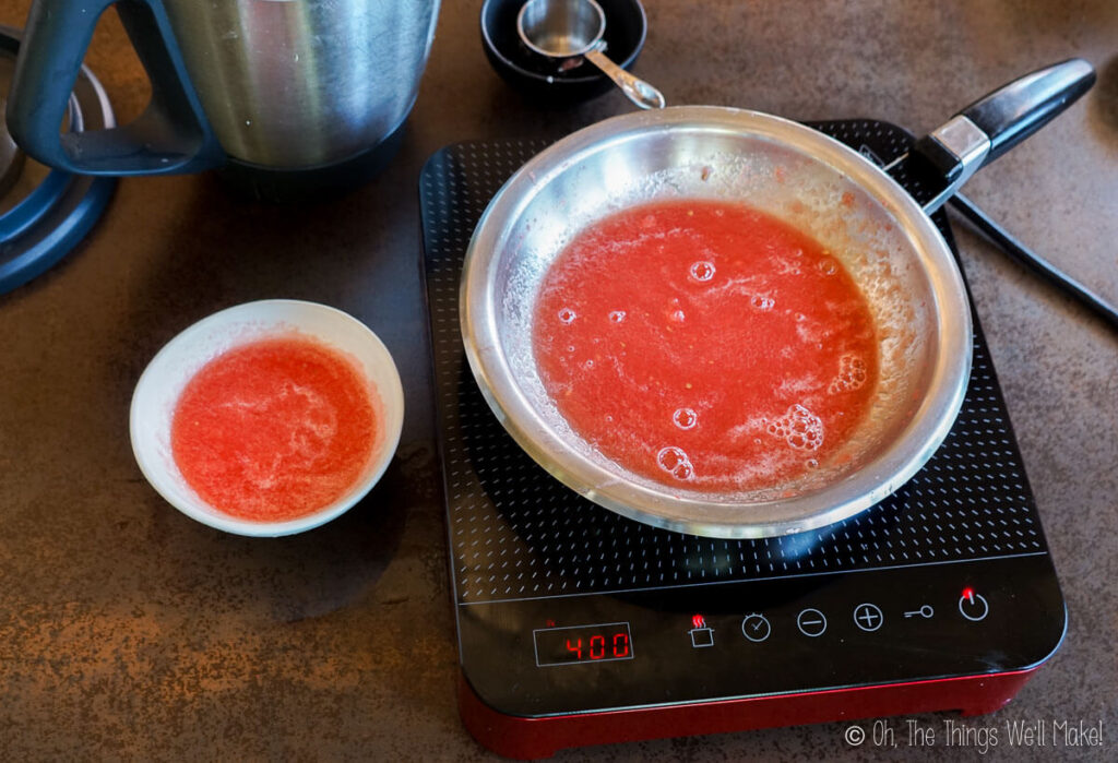 a bowl of gelatin blooming in watermelon purée next to a saucepan with watermelon purée.