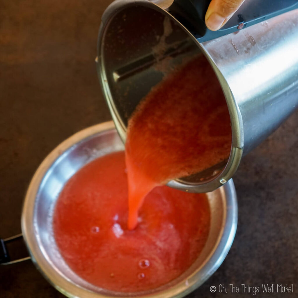 pouring watermelon purée into a saucepan with the gelatin mixture