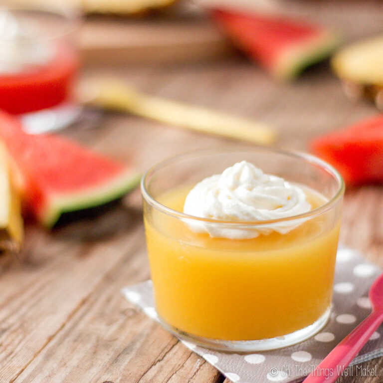 Closeup of homemade pineapple gelatin in front of homemade watermelon gelatin.