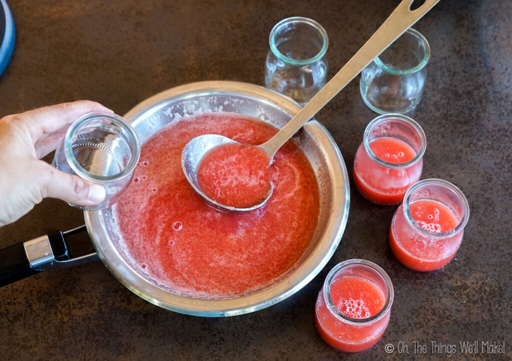 Using a ladle to add the watermelon mixture to serving cups