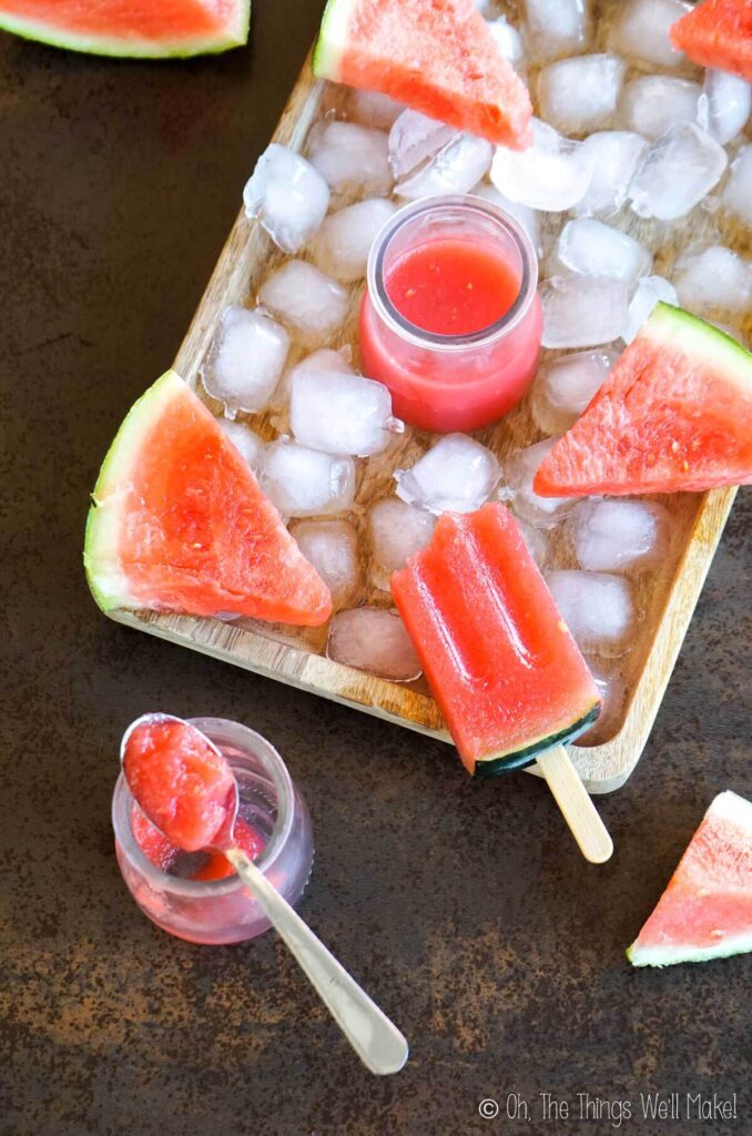 Overhead view of watermelon gelatin and watermelon gelatin powpsicles.