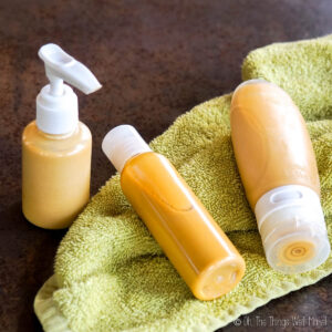 3 different bottles of a homemade body shimmer oil