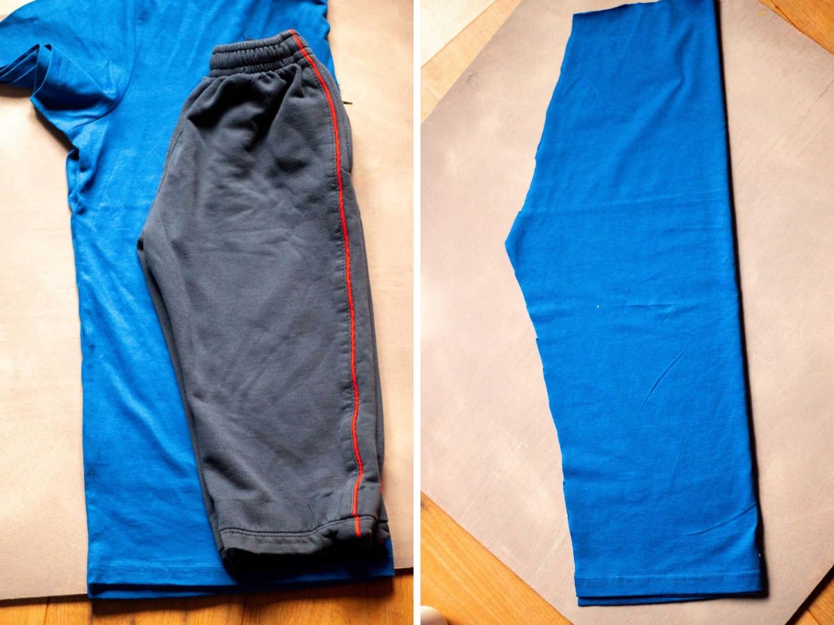 Blue T-shirt with a pair of shorts used as a pattern, alongside a cut fabric piece for homemade costume pants