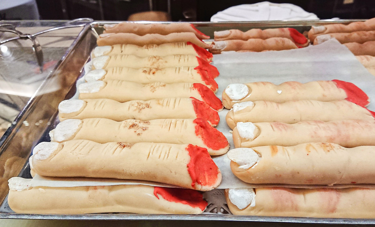 A tray covered in witches' finger cookies