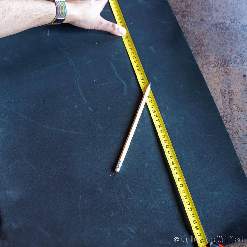 Measuring out a 9 centimeter wide strip of craft foam