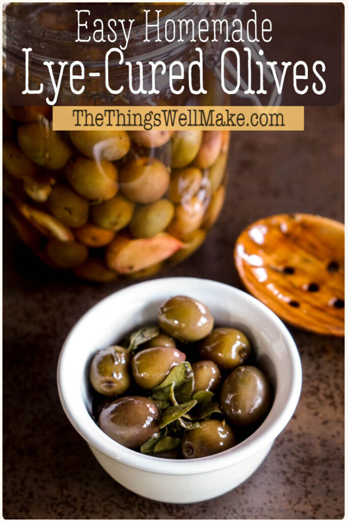 Lye cured olives are a traditional snack made by soaking whole green olives in a lye solution and then brining them for flavor and preservation. Learn how easy it is to lye cure olives at home (and why you'd want to). #olives #lyecured #brine #preservation #thethingswellmake #miy