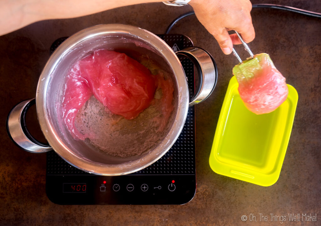 Placing the thickened mixture into a silicone mold with a spatula