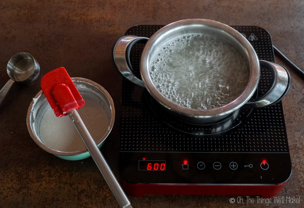 Boiling sugar syrup next to a bowl of starch and water