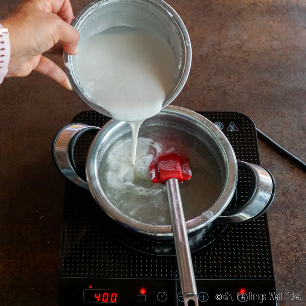 Pouring a starch mixture into a sugar syrup
