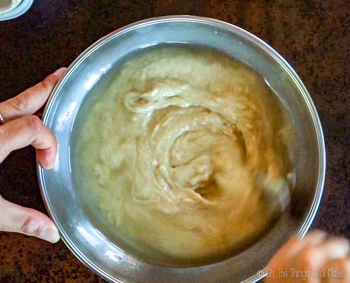 Stirring cashew butter, almond butter, and coconut oil