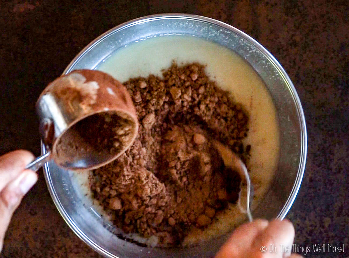 Pour cocoa powder into a bowl with a nut butter mixture