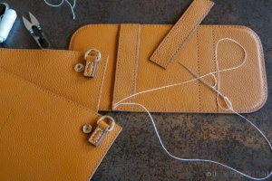 Sewing up the bottom of the purse