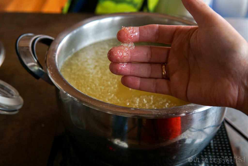 Holding the impurities from the surface of the beef tallow.