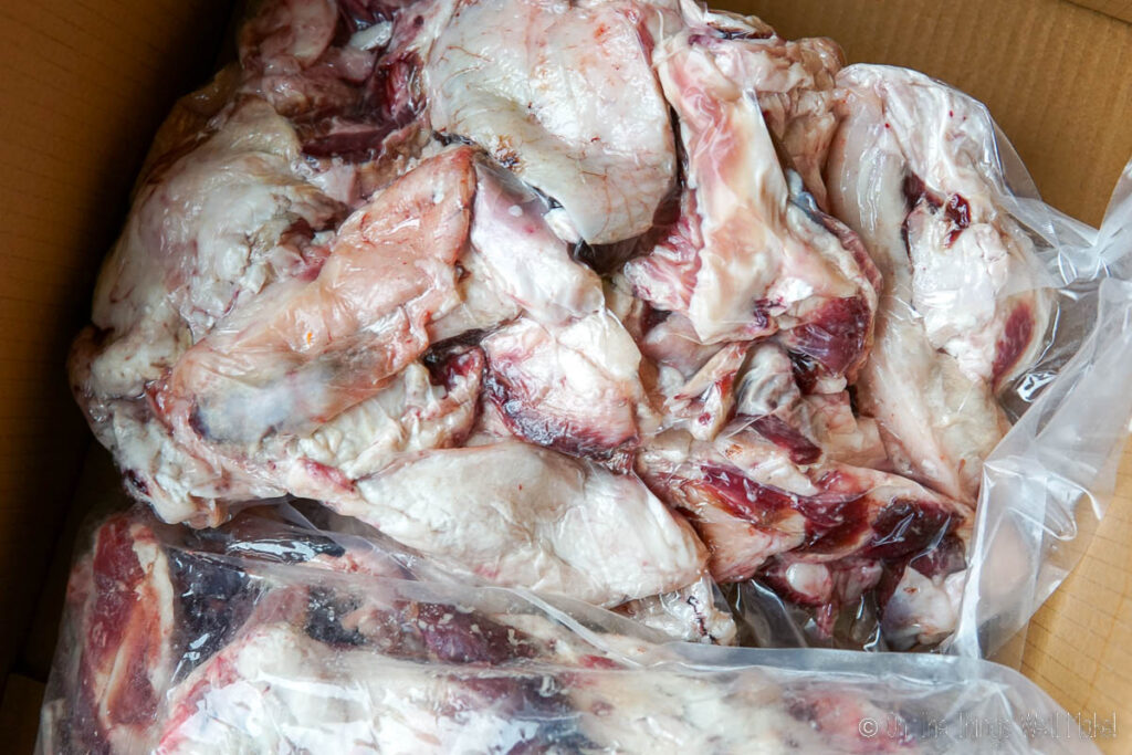 A bag of cuts of beef suet and meat pieces