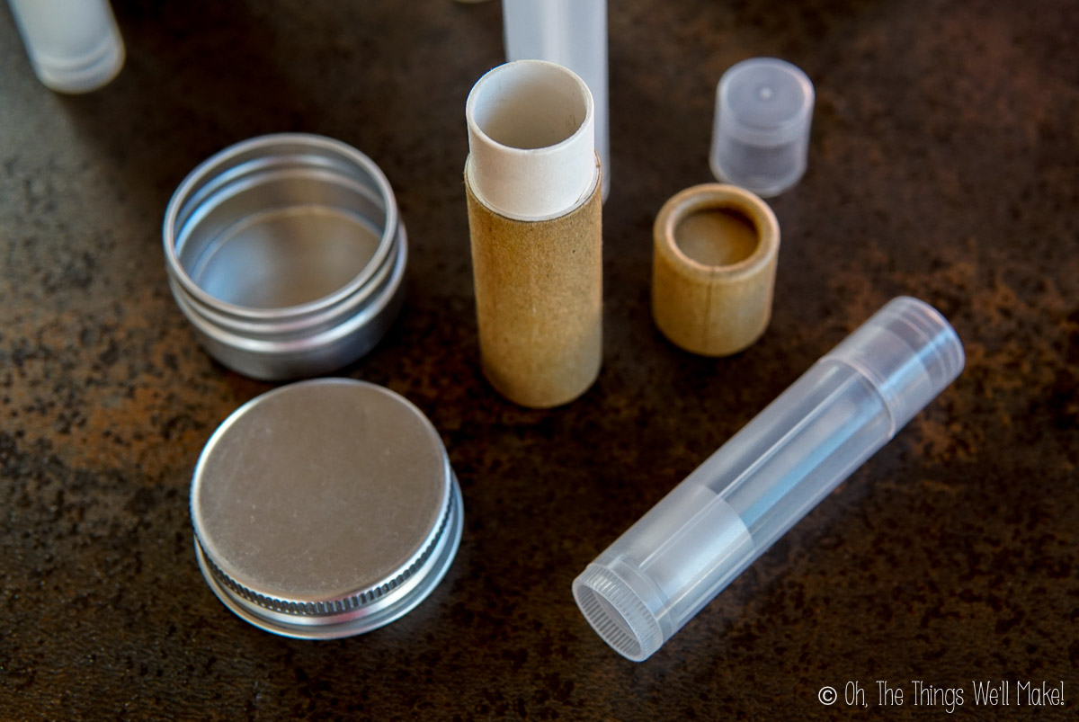 Empty lip balm tubes and a metal tin