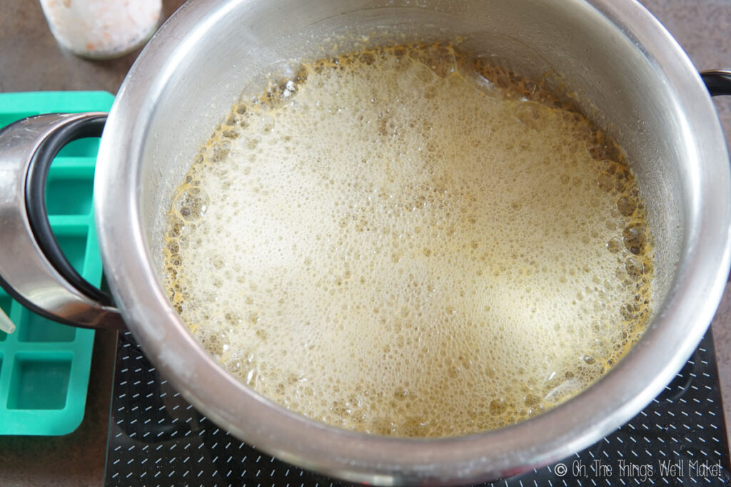 Foaming melted butter in a pot at the beginning stages of melting the butter