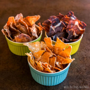 turkey, pork, and beef meat chips in colorful bowls