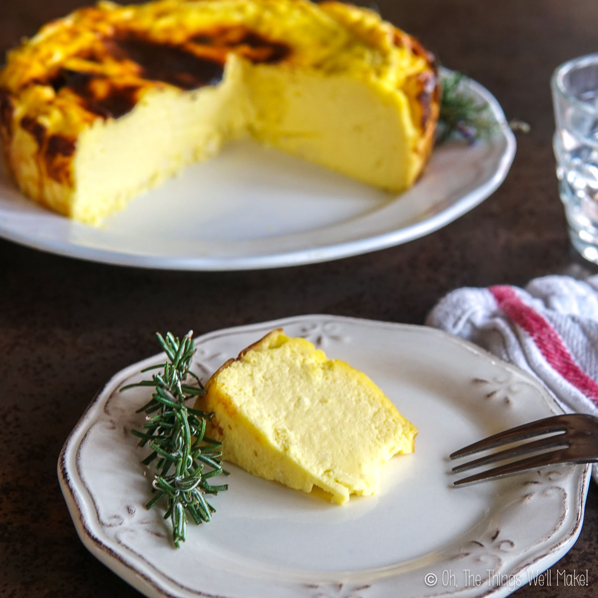 A slice of carnivore cheesecake on a plate in front of the rest of a cheesecake on another plate