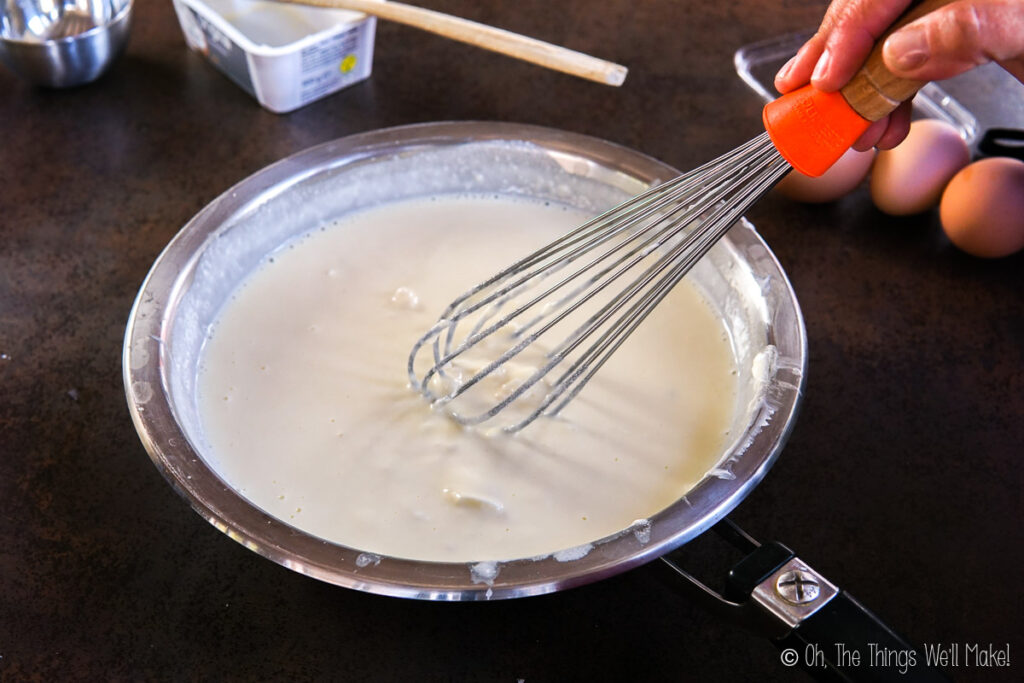 Cream with melted Manchego cheese in a pan